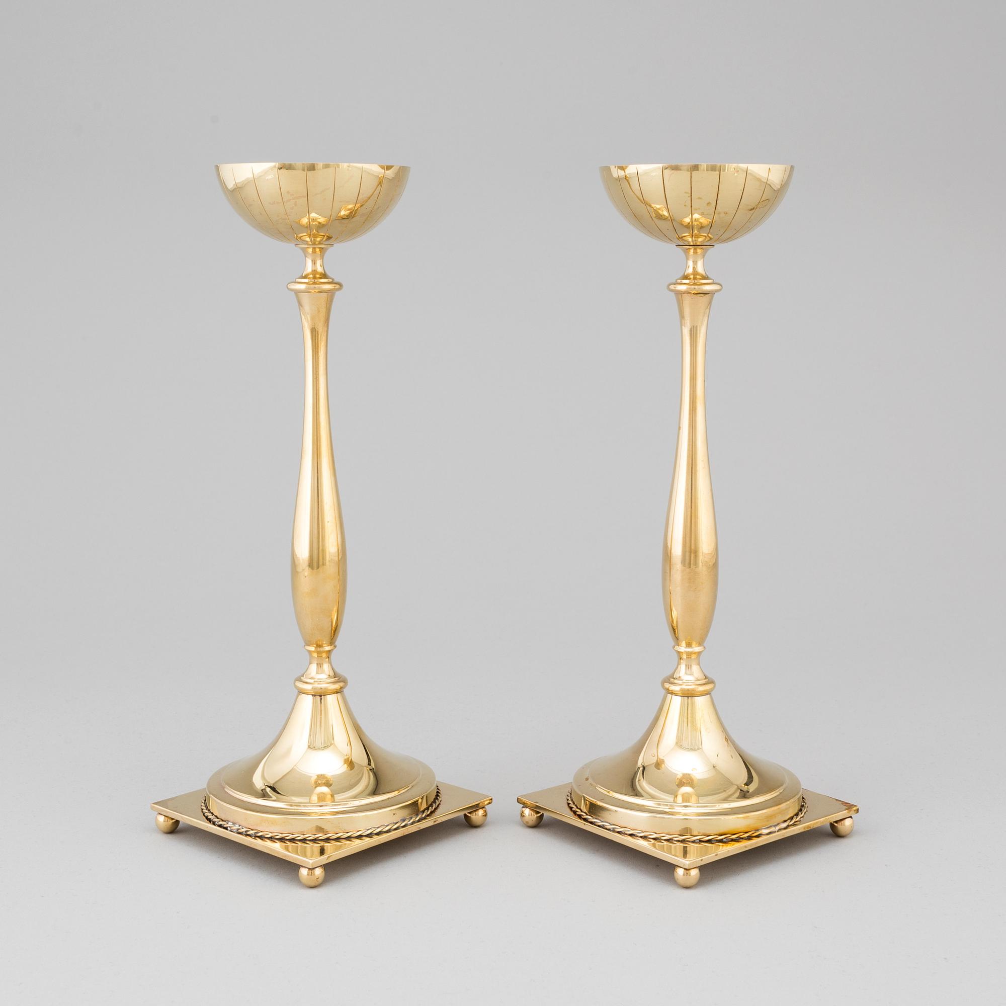 A pair of mid 20th century brass candlesticks by Gunnar Ander for Ystad Metall.