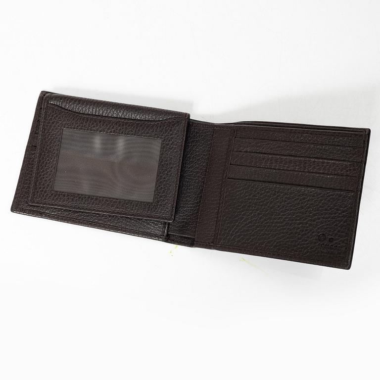 Gucci, wallet and belt.
