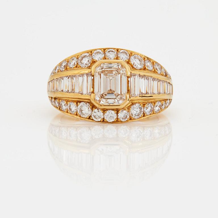 A RING set with an emerald-cut diamond.