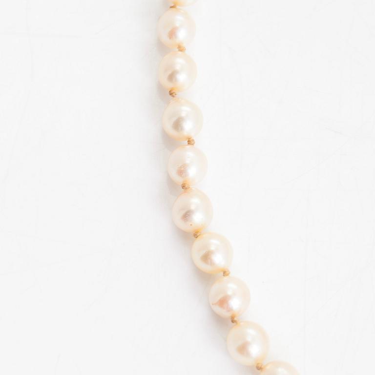 A cultured pearl necklace, clasp with white zircons.