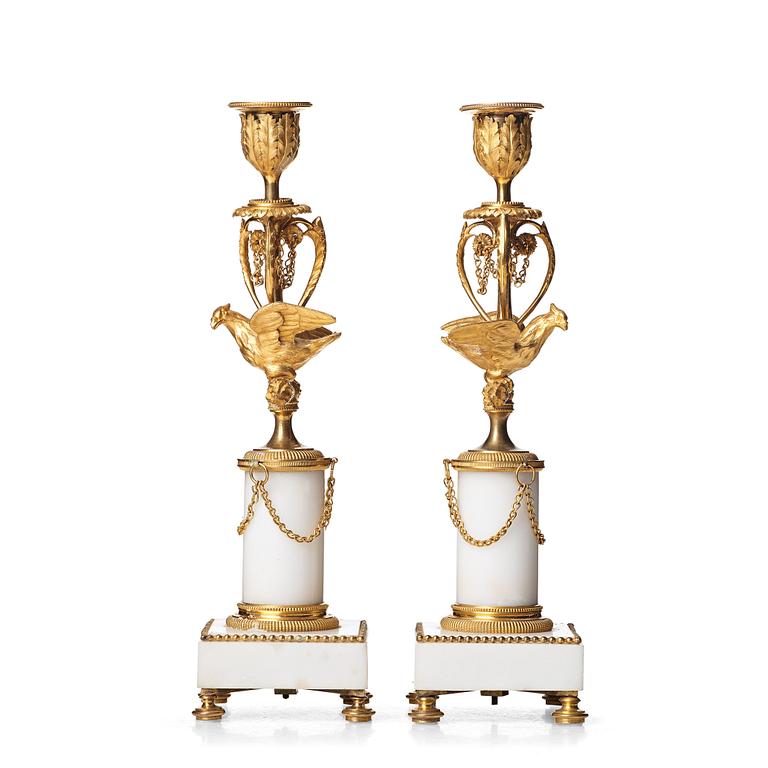 A pair of Louis XVI late 18th century candlesticks.