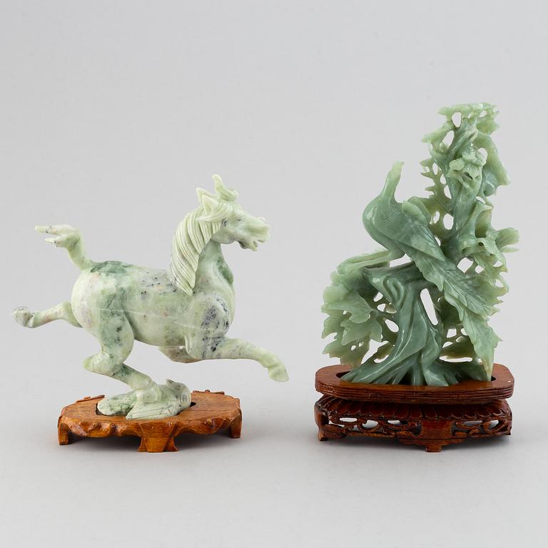 Two Chinese green stone figurines, 20th century.