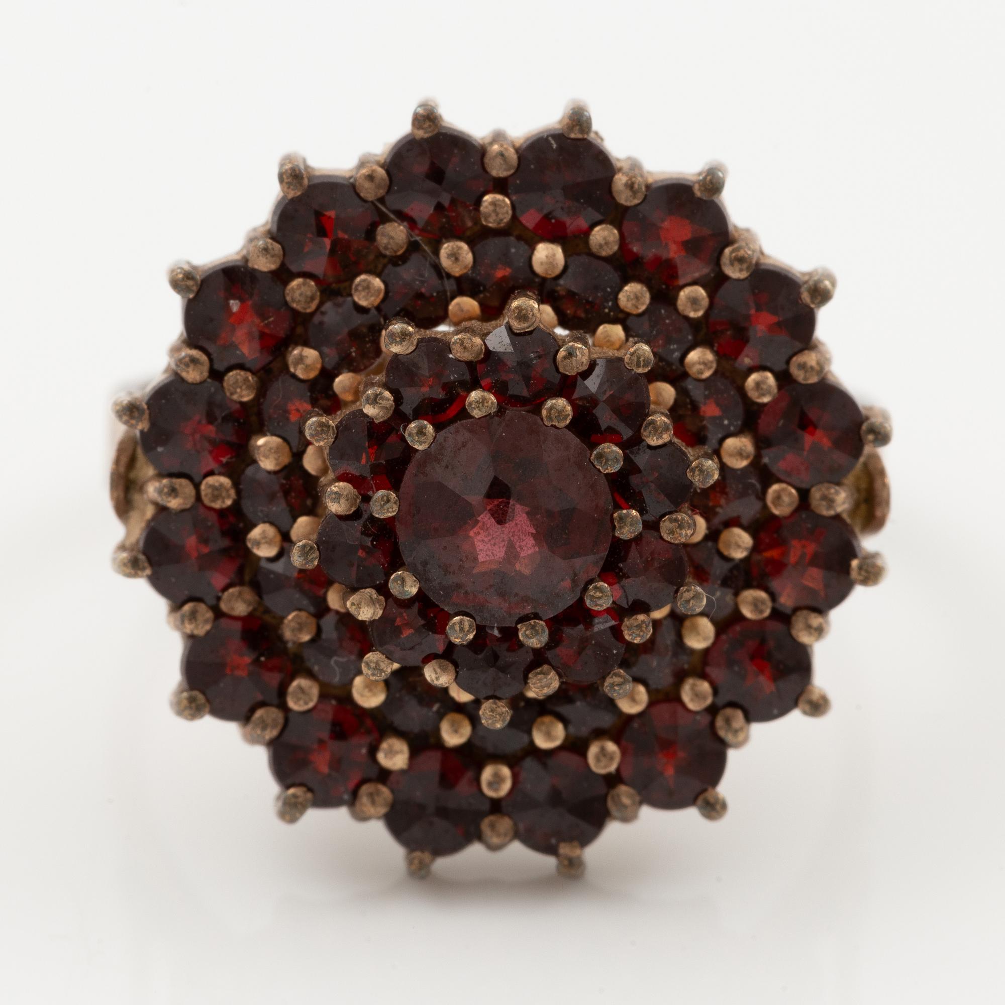 Garniture, two rings, brooch, two necklaces, and two pairs of earrings, armlet, garnets.