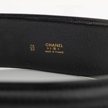 Chanel, a black leather and gold tone metal belt.