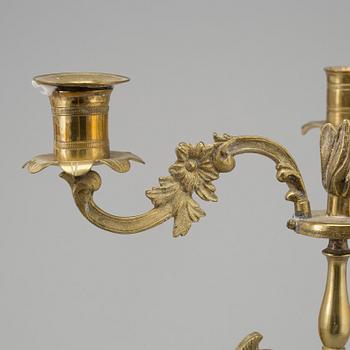 A pair of brass and marble candelabra, early 20th century with older parts.