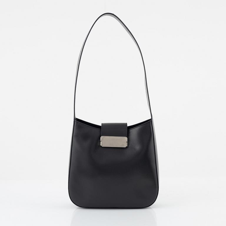 Prada, a dark grey leather bag.