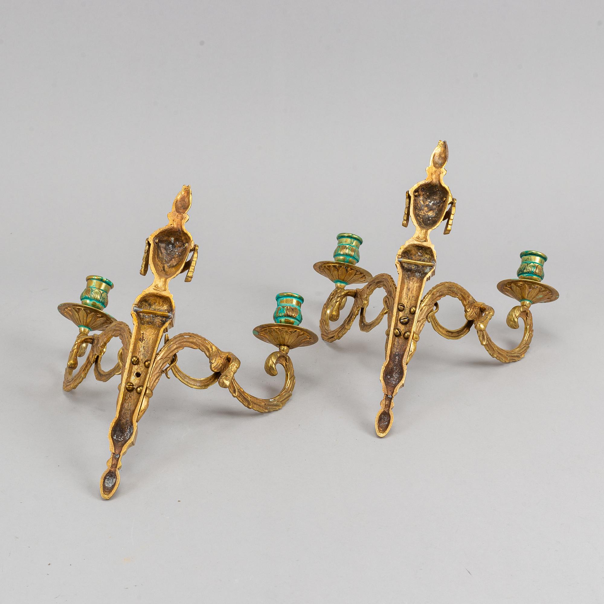 A pair of wall sconces, Louis XVI style, early 20th century.
