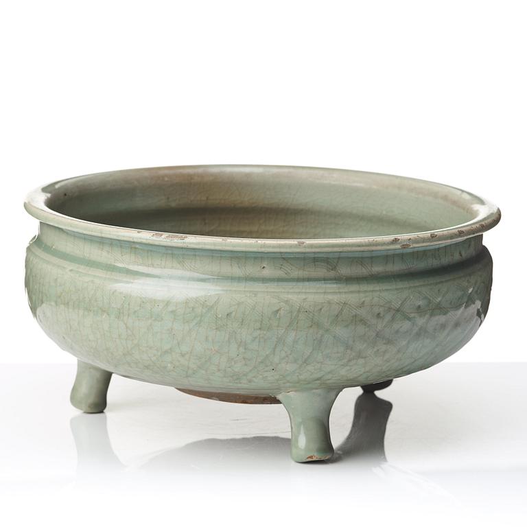 A celadon glazed tripod censer, Ming dynasty (1368-1644).