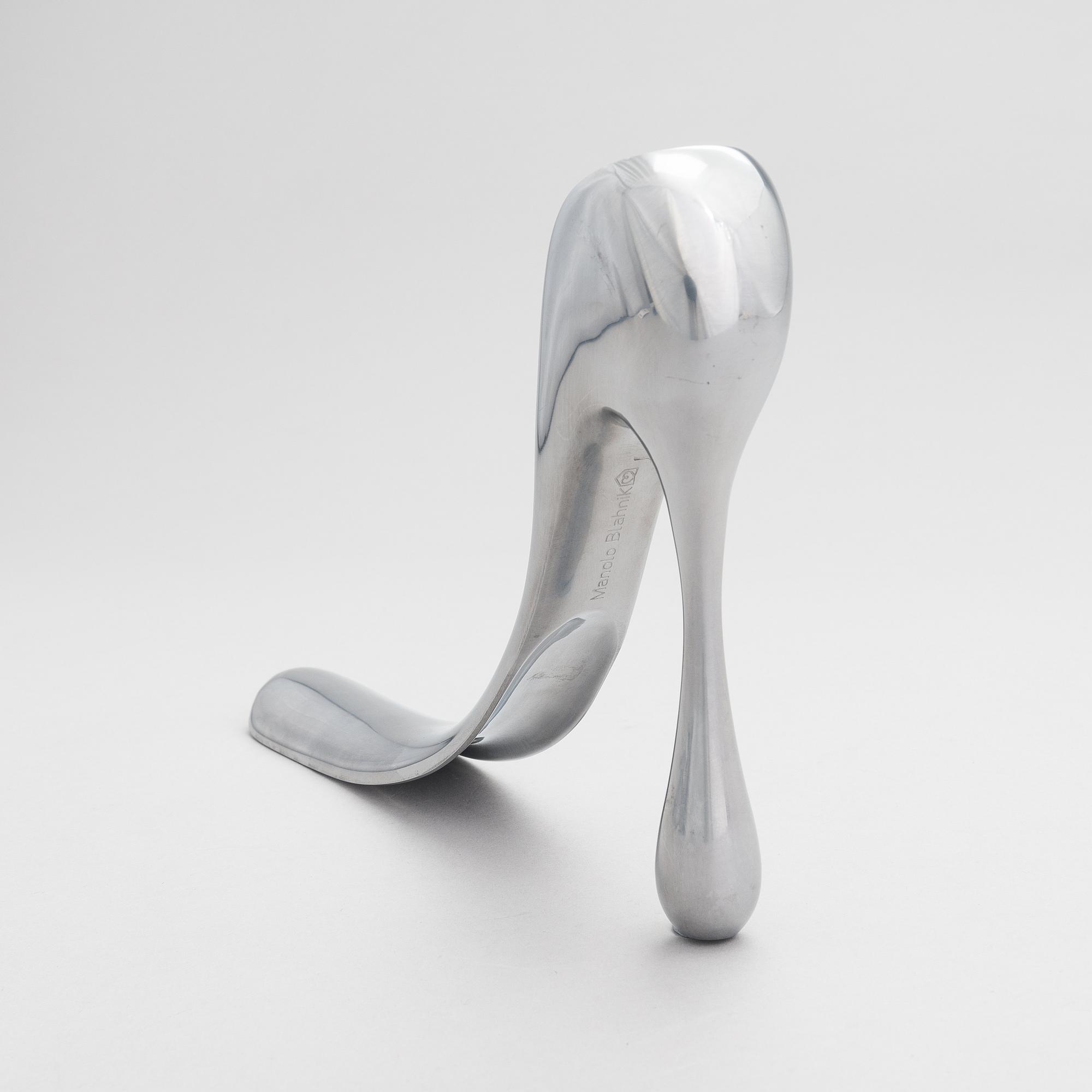 A metal shoe horn by Manolo Blahnik, 2000s.