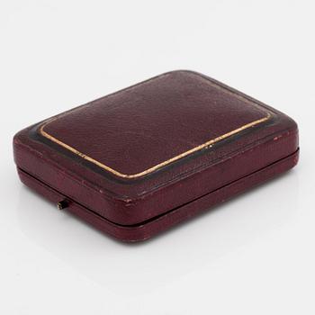 A ladies watch that can be worn as a brooch. Enamel set with diamonds. Cylinder escapement. Circa 1890-1900.