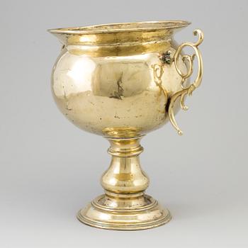 A 19th century brass champagne cooler.