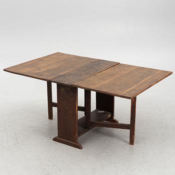 A drop-leaf table, 19th Century.