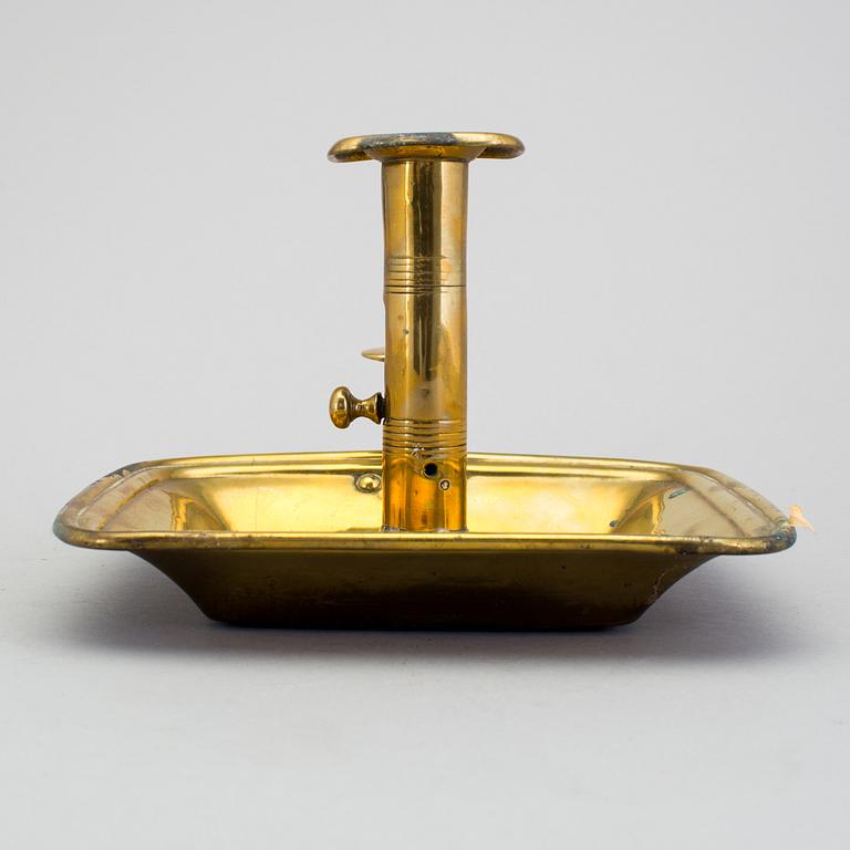 A 19th century brass candlestick.