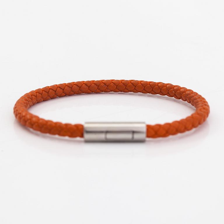 Hermès, A leather and metal bracelet. Marked Hermès Made in Italy.