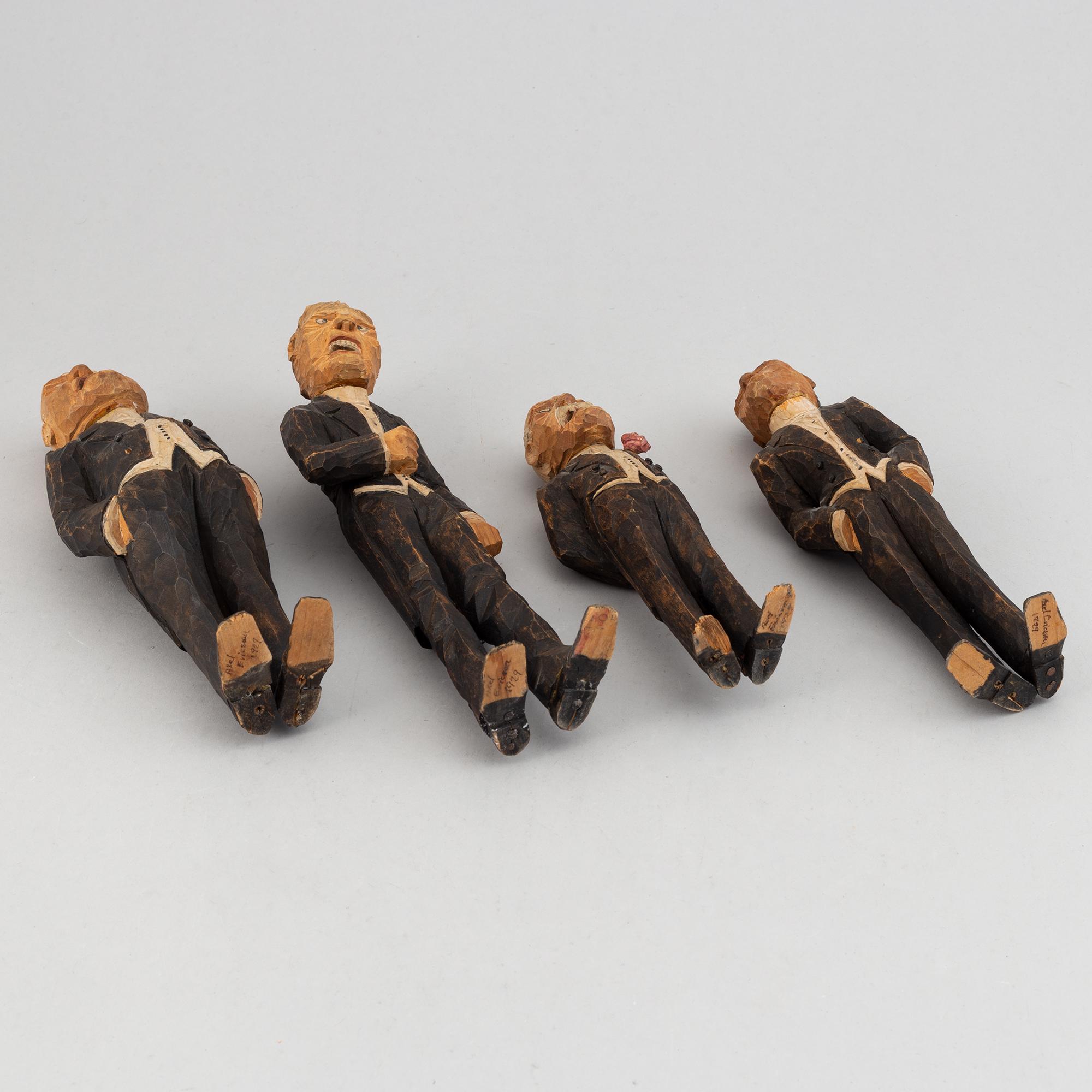 Four wooden sculptures by Axel Ericsson, signed and dated -29.