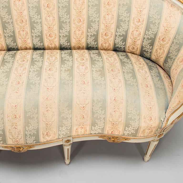 A Gustavian style sofa and table from early 20th century.