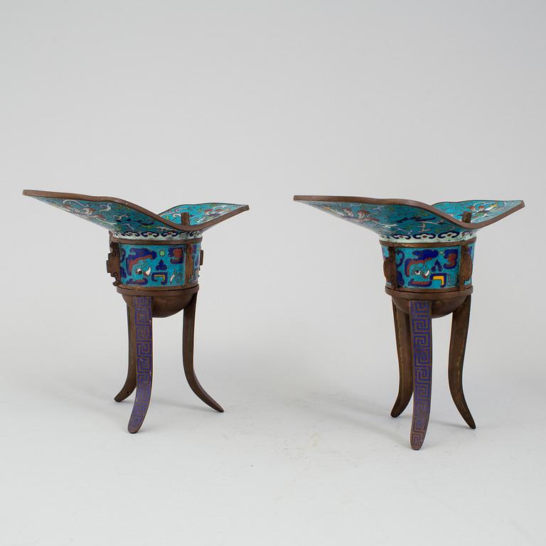 A pair of chinese cloisonné tripod wine vessels, 20th century.