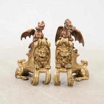 Fire dogs a pair of Baroque style 20th century in the manner of Charles Cressent.