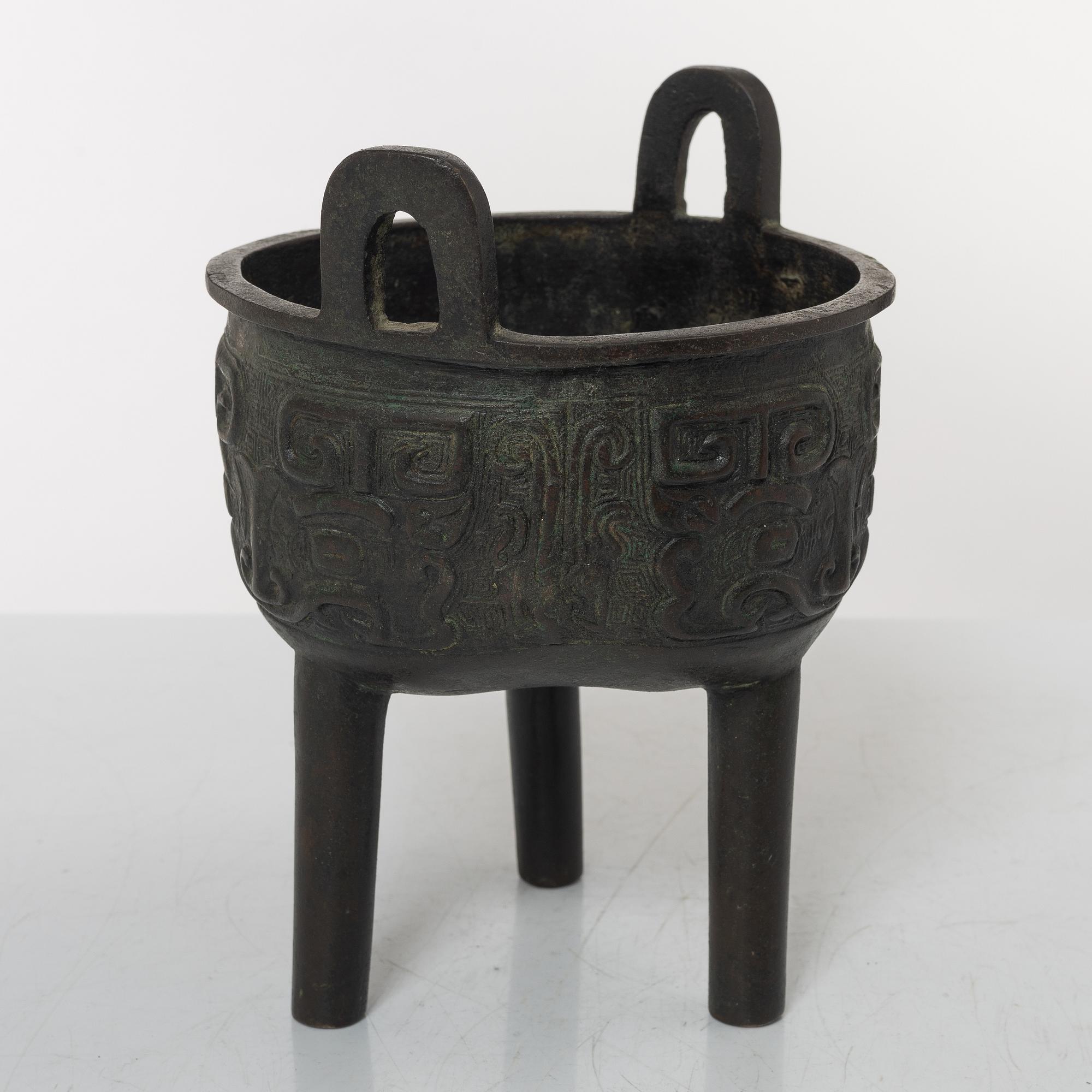 A Chinese tripod bronze censer, Ming style, Qing dynasty (1644-1912).