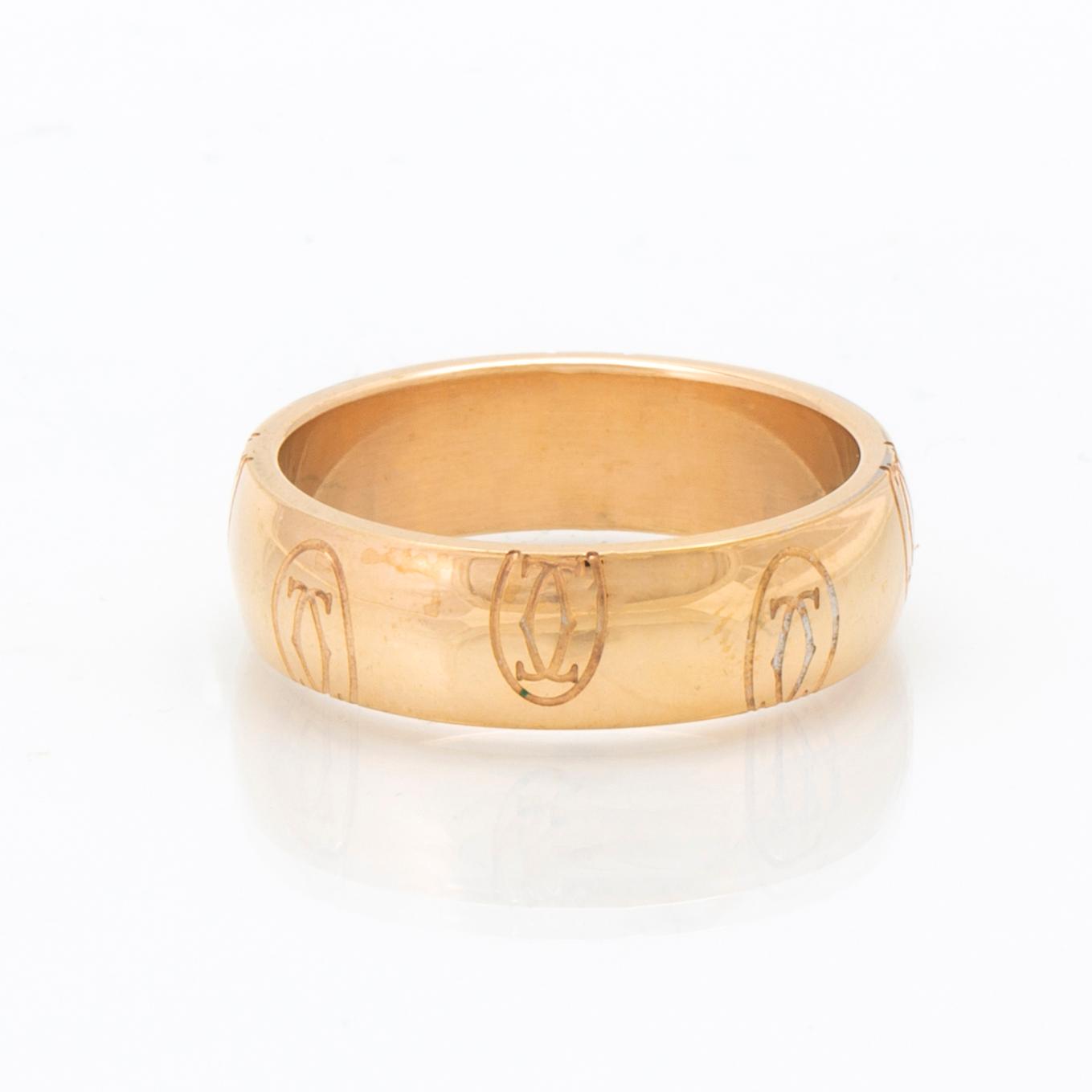 An 18K gold ring "Logo de Cartier" by Cartier.