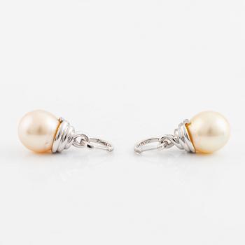 A pair of 18K white gold cultured South Sea pearl earrings.