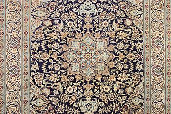 A Nain carpet, part silk, c. 338 x 244 cm.