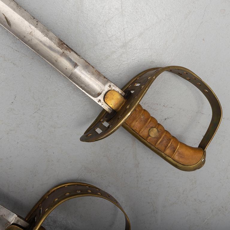 Two cavalry sabres 1867 pattern with scabbards.