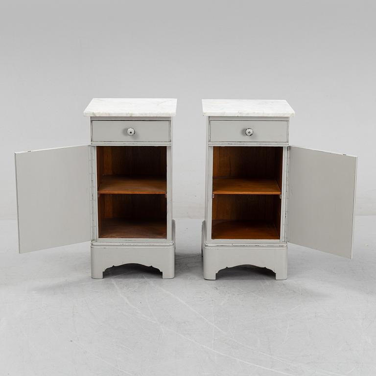 A pair of marble top bedside tables, first half of the 20th Century.