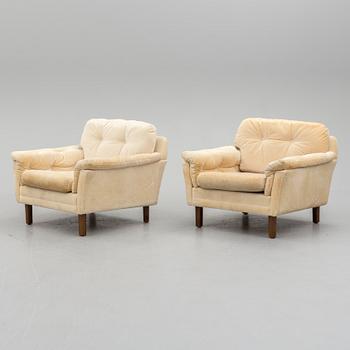 A pair of last quarter of the 20th century Dux easy chairs.