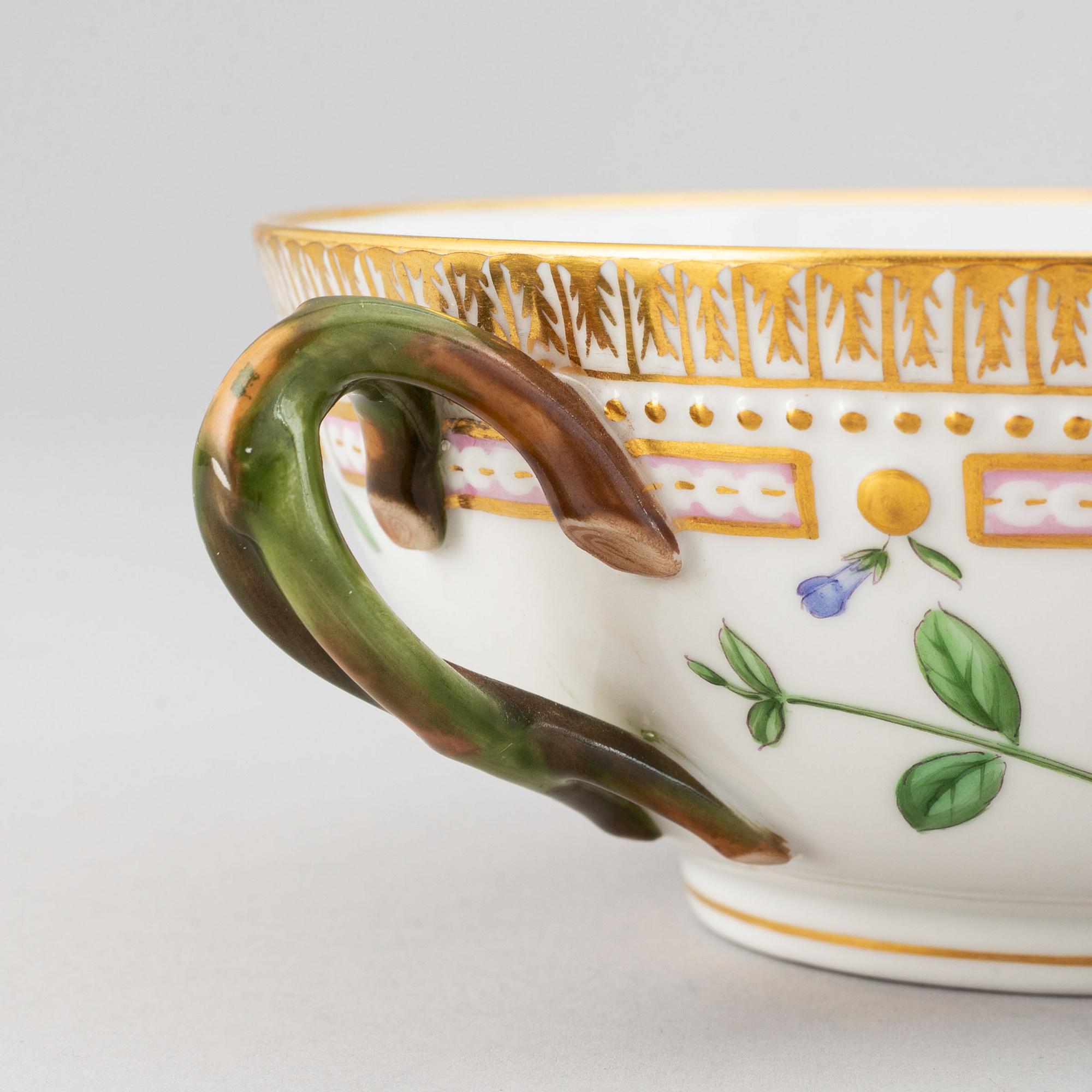 Royal Copenhagen, A 'Flora Danica' porcelain soup cup with saucer.