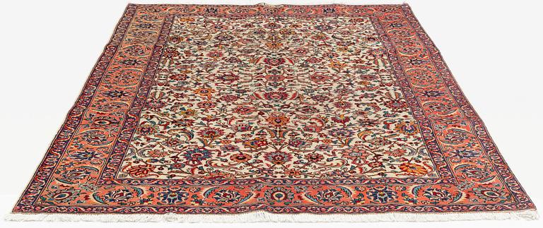 A carpet, semi-antique Tabriz, signed Aamal-Hassa, ca 284 x 188 cm cm.