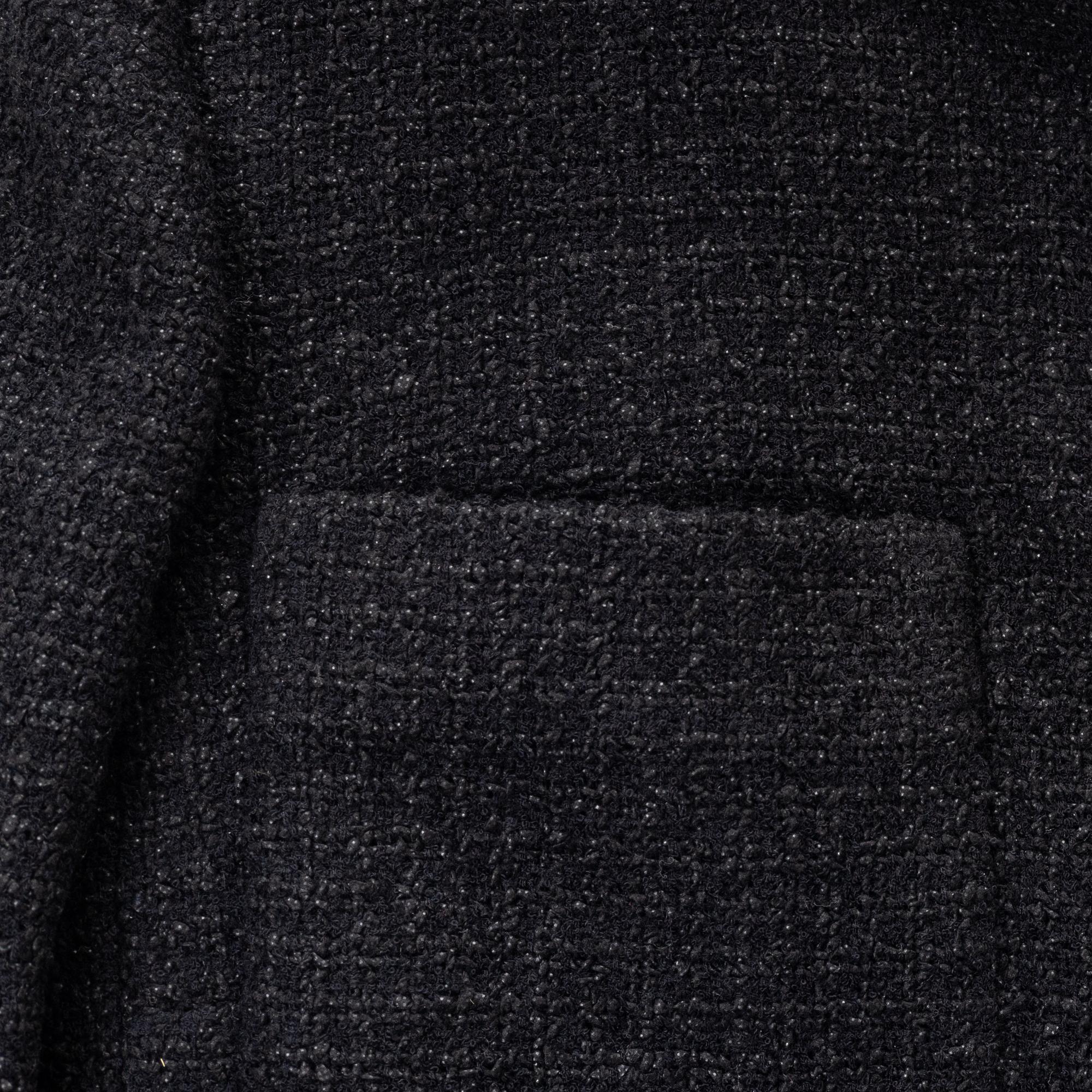 Chanel, A black bouclé jacket, size 34.