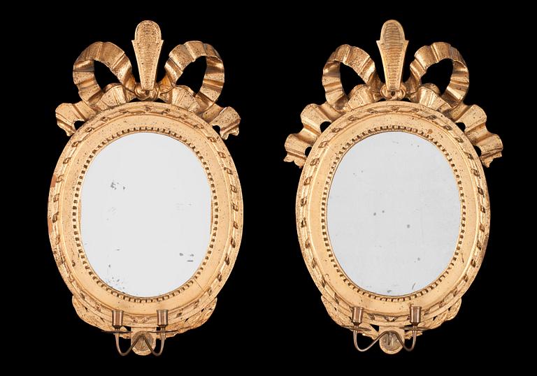 A pair of Gustavian two-light girandole mirrors by N. Falkengren.
