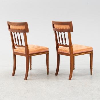 An Empire style table, a sofa and eight chairs, early 20th Century.