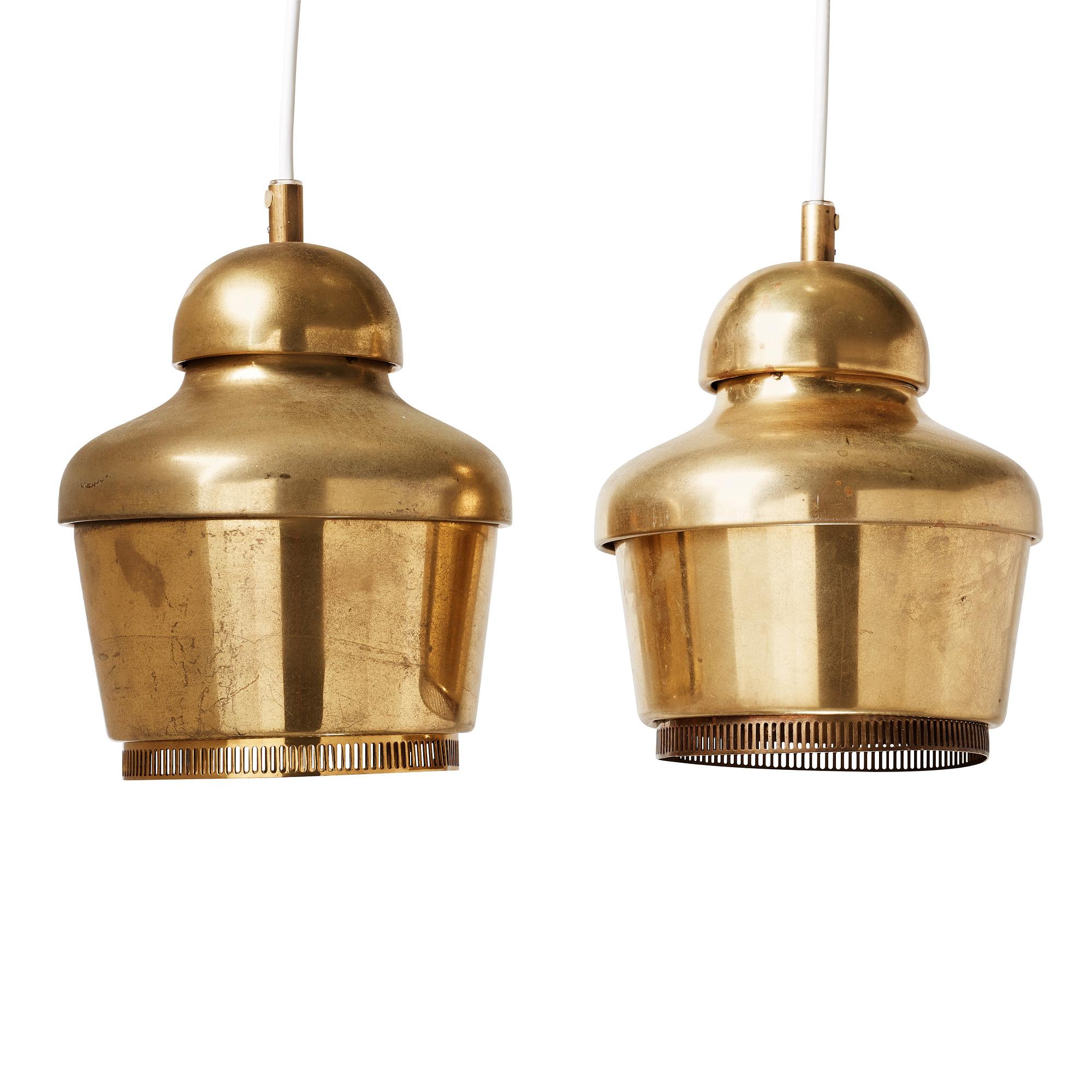A pair of Alvar Aalto 'A330' brass pendant lamps, Valaistustyö, Finland.