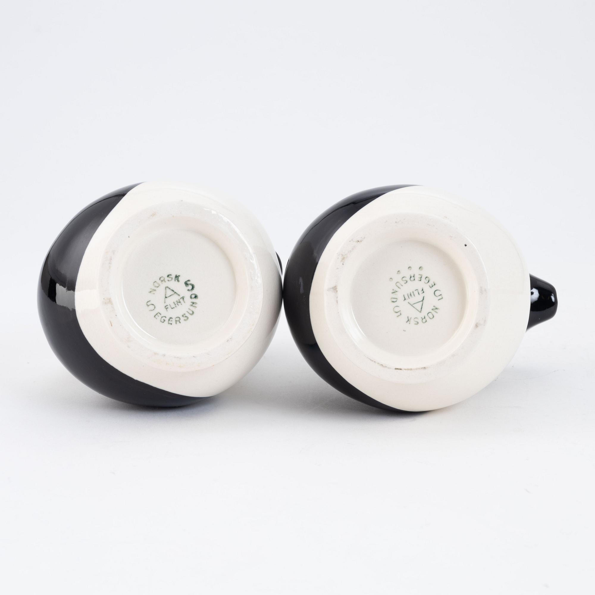 A pair of creamware ewers, "Alkemugge", Egersunds Fayancefabrik, Norway, designed 1910, produced around 1930.