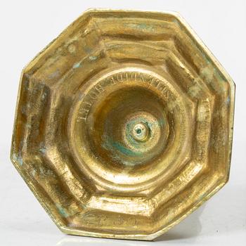 A pair of Louis XVI-style brass candle sticks, first half of the 20th century.