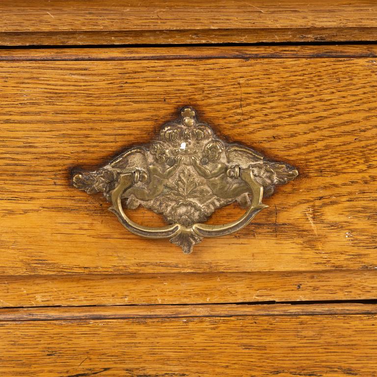 A Rococo cabinet, later part of the 18th Century.