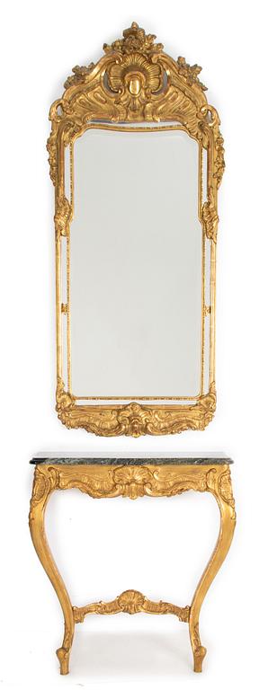 A Rococo style mirror and a console table, first half of the 20th Century.