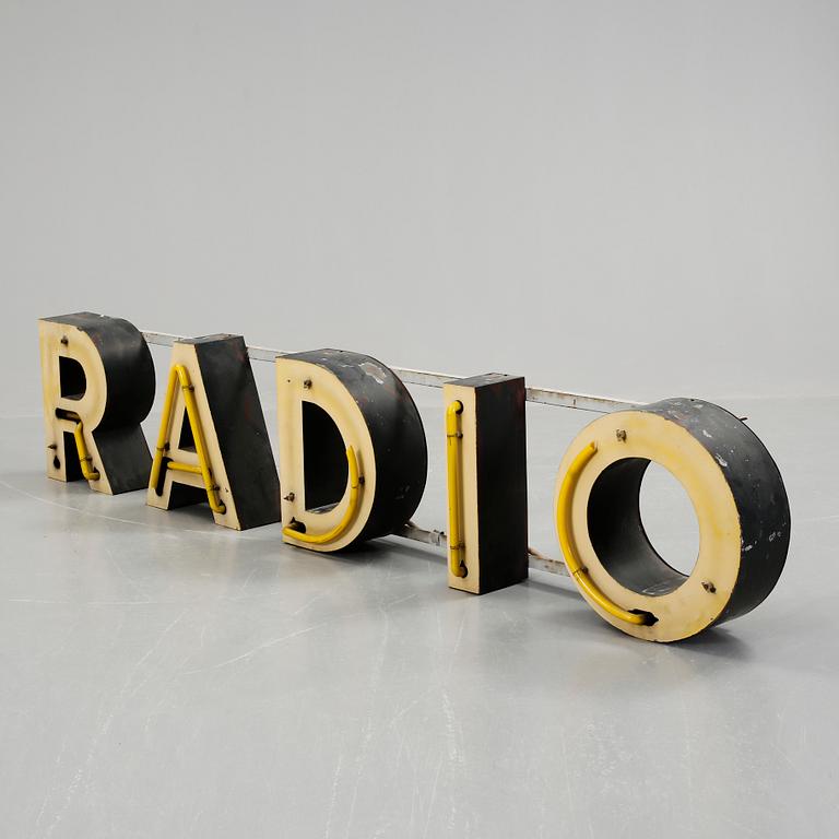 FASADSKYLT. "RADIO", 1900-talets första hälft.