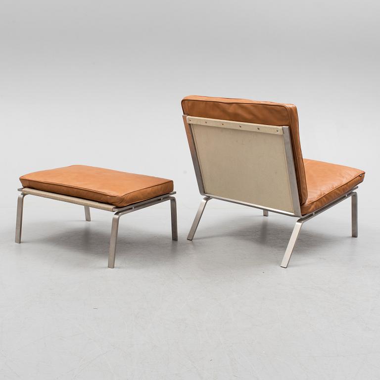 A 21st century easy chair and foot stool by Norr 11, Denmark.