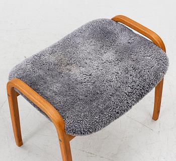 Yngve Ekström, a 'Lamino' armchair with footstool, Swedese, 2004.
