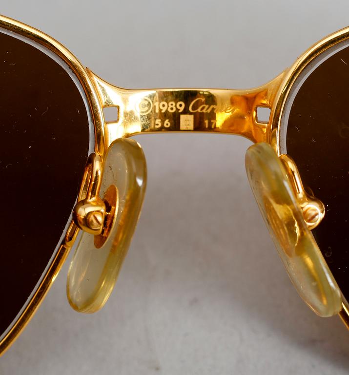 SOLGLASÖGON, Cartier.