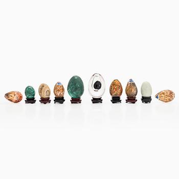 A set of 10 glass and stone decorative eggs.