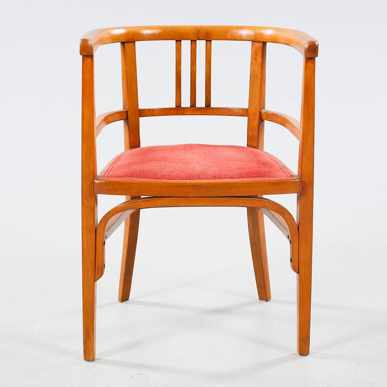 A table and a arm chair from the second quarter of the 20th century.