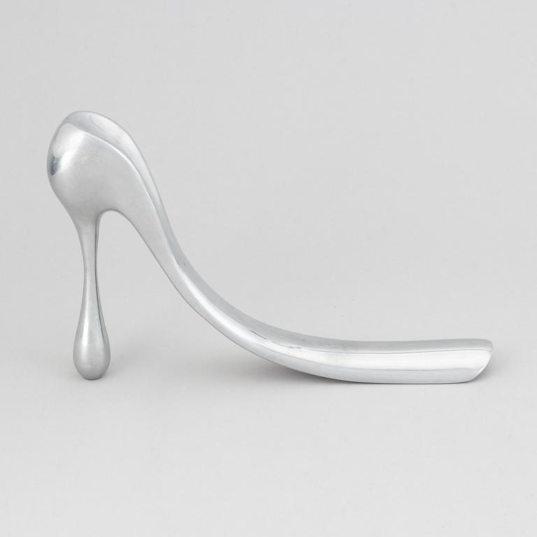 Manolo Blahnik, a metal shoe horn, 21st century.