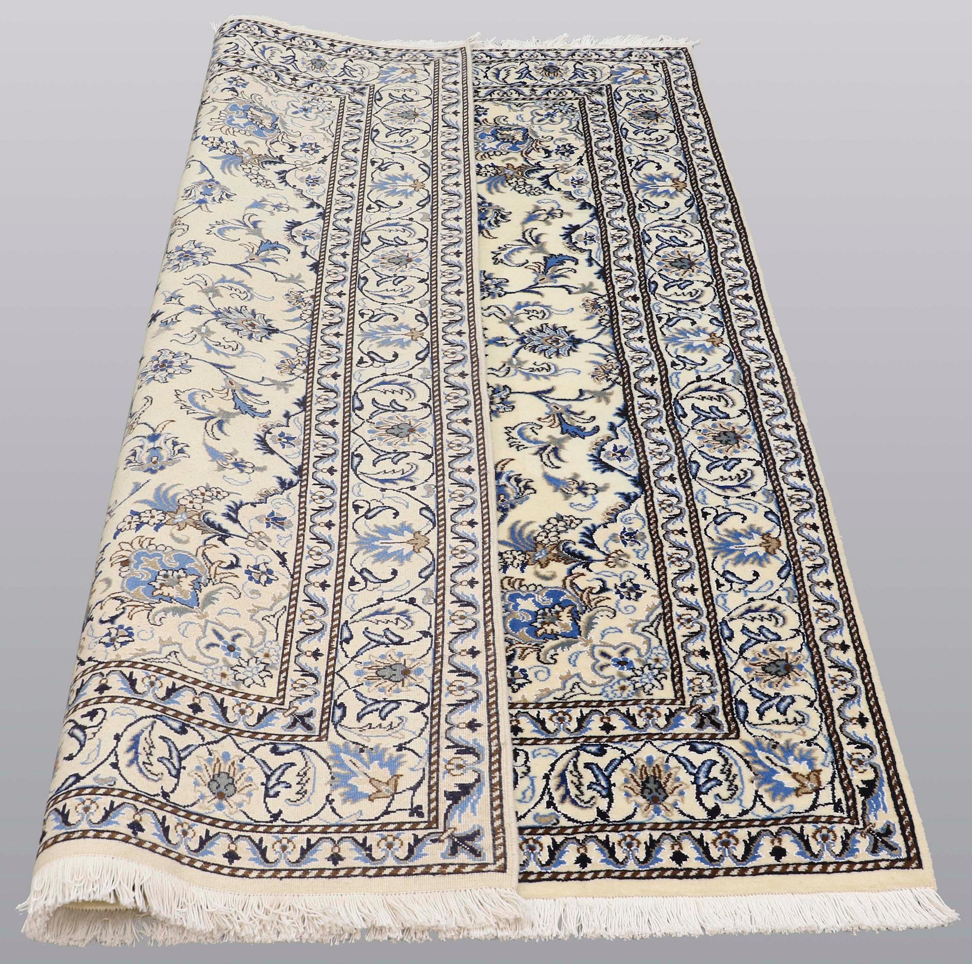 A rug, Nain part silk, ca 235 x 160 cm.