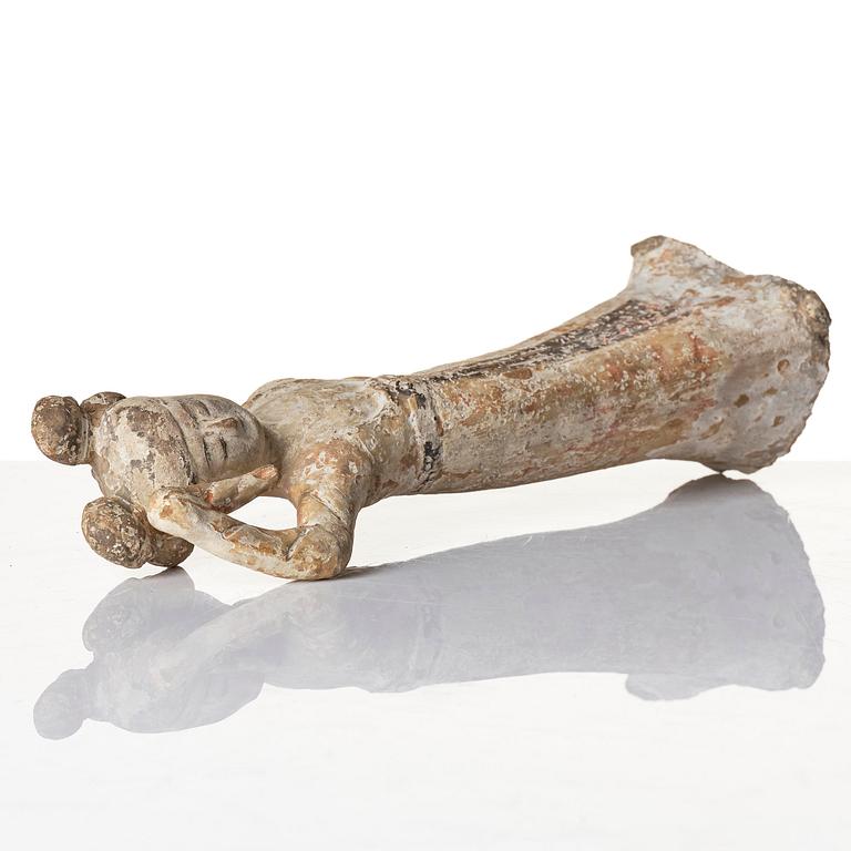 A painted pottery figure of a female dancer, Tang dynasty (608-906).
