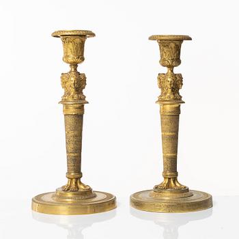 A matched pair of candlesticks, Empire, France, first half of the 20th century.
