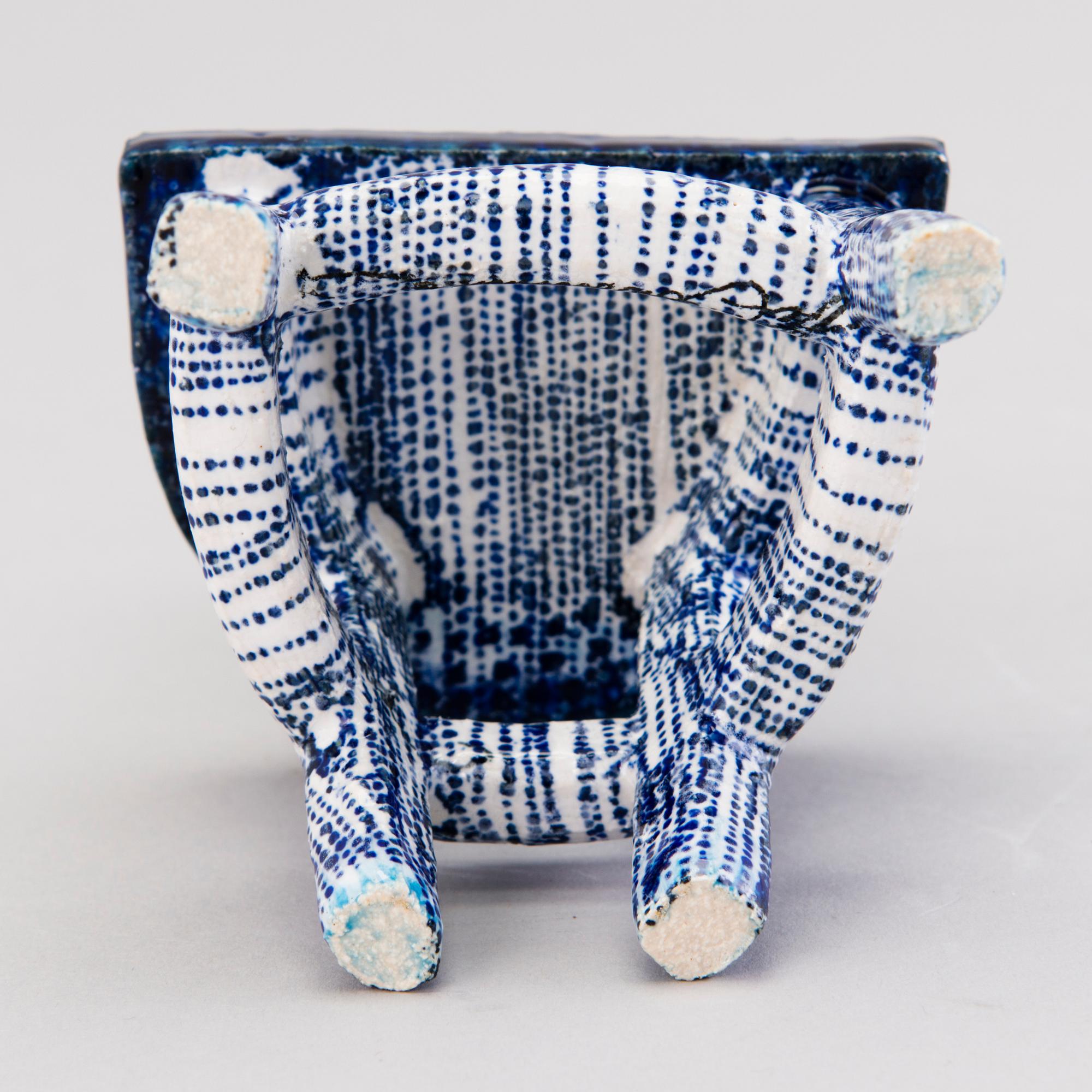 HEINI RIITAHUHTA, a porcelain miniature sculpture 'Chair' signed Heini Riitahuhta.